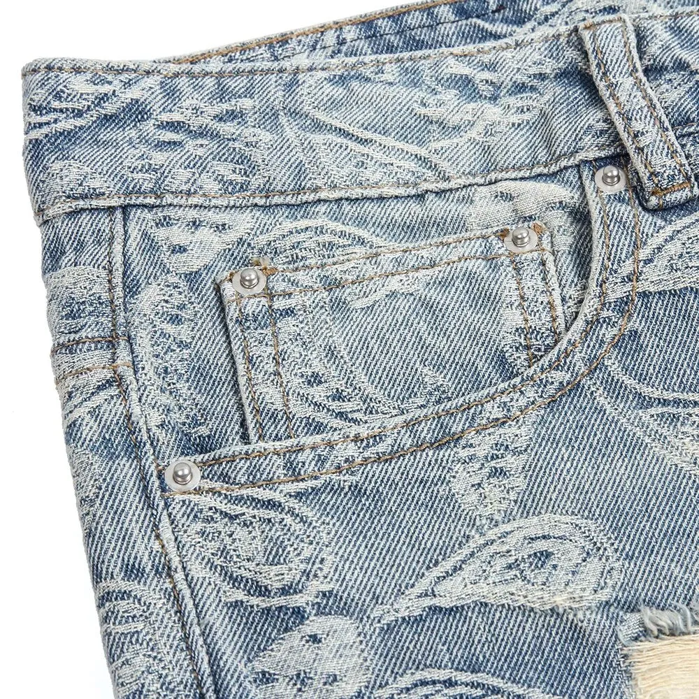 Ripped Denim Jeans with Ankle Zip and Paisley Pattern Embroidery